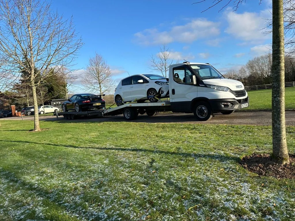 A TD Vehicle Solutions recovery truck with a vehicle loaded