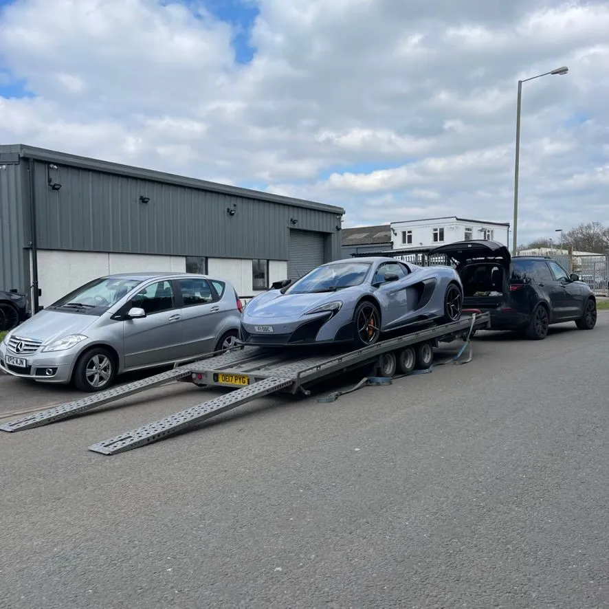 A McLaren being loaded onto a TD Vehicle Solutions transporter
