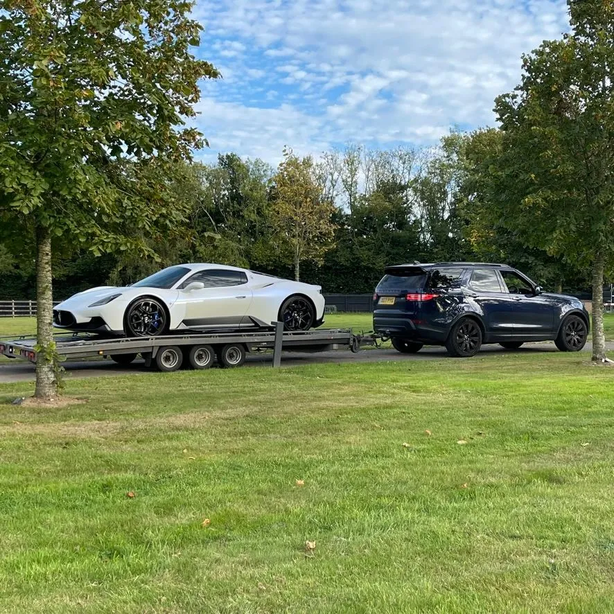 White Maserati MC20 on a TD transporter
